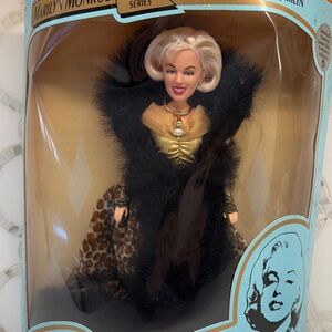 Marilyn Monroe Collector Doll with Black Fur and Gold Dress. New in box